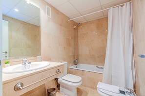 Bathtub, hair dryer, bidet, towels