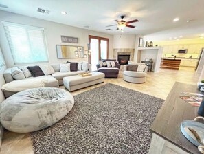 Smart TV, fireplace, books, stereo