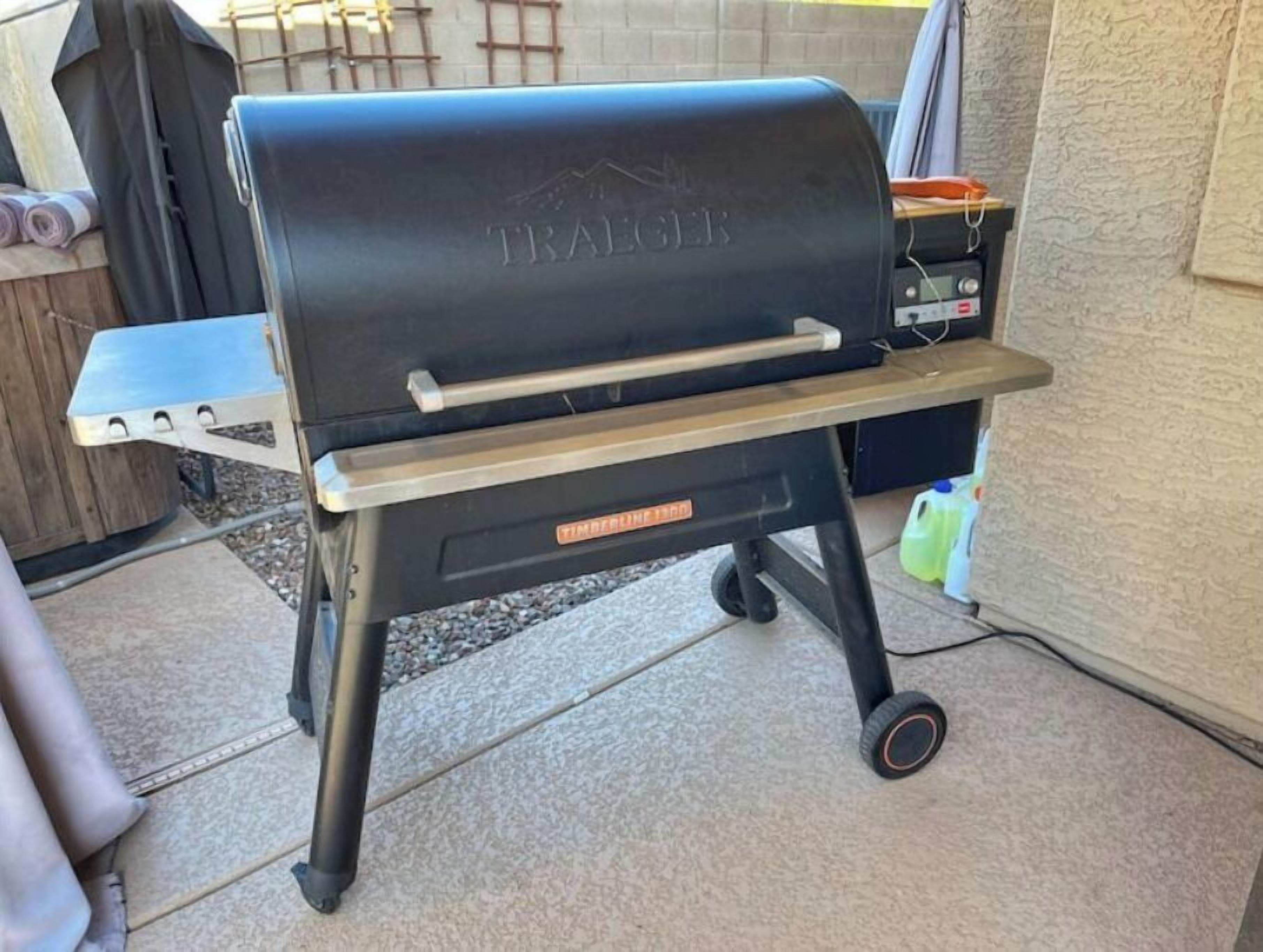 A portable grill with wheels, labeled 'TRAILER', and a 'TIMBERLINE 1500' label.