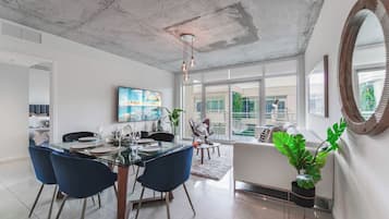 Apartment, 2 Bedrooms | Living area | 50-inch Smart TV with cable channels