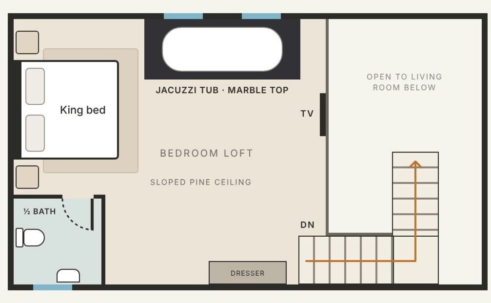 Een slaapkamer met een kingsize bed, een gastentoilet, een badkamer en kleedkamer, en een televisie.