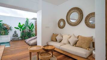 Basic Villa, Multiple Beds | Living area | 50-inch TV with digital channels, streaming services