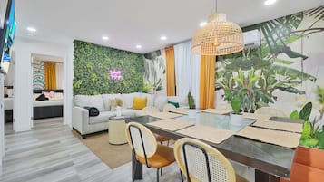 Comfort Apartment | Living area | 50-inch Smart TV with cable channels, streaming services