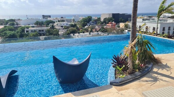 Relax by the pool with a stunning city view.