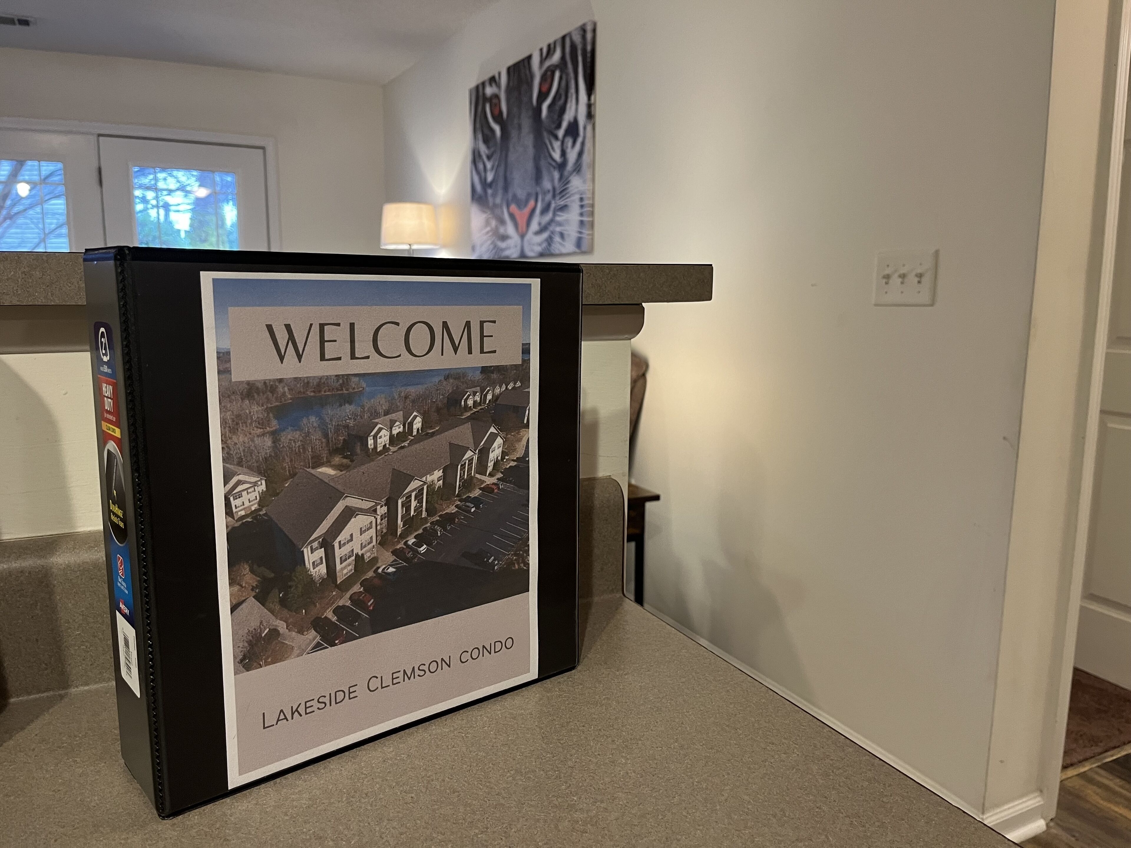 A welcome sign for Lakeside Clemson Condo with a view of the neighborhood.