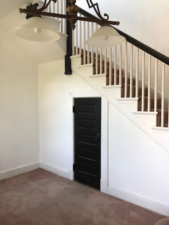 Interior. Relax in beautiful second floor apartment with balcony & private fenced yard.