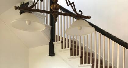Relax in beautiful second floor apartment with balcony & private fenced yard.
