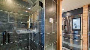 A modern kitchen with stainless steel appliances, a built-in oven, and a refrigerator. - Outdoor Pool & Patio: Quiet Whitney Retreat! (Whitney)