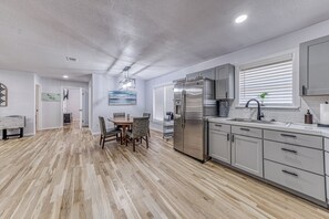 Coffee/tea maker, cookware/dishes/utensils, dining tables