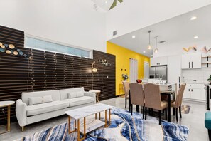 Relax in this stylish space with a sofa, dining area, and fully equipped kitchen.