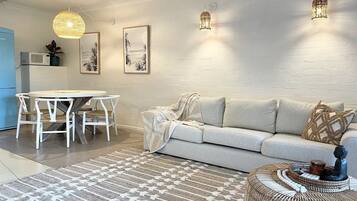 Apartamento conforto | Área de estar | Smart TV