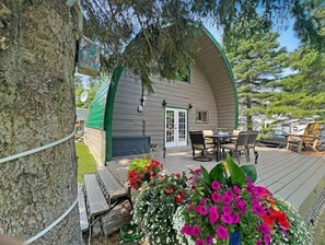 Enjoy dining or socializing on the sheltered porch with a table and chairs.