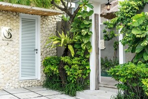 A stone building with a sign reading "The Swan Villas 2". - 2 Bedroom Villa In Seminyak With Private Pool (Bali)