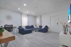 Comfort Apartment | Living area | 32-inch Smart TV with cable channels