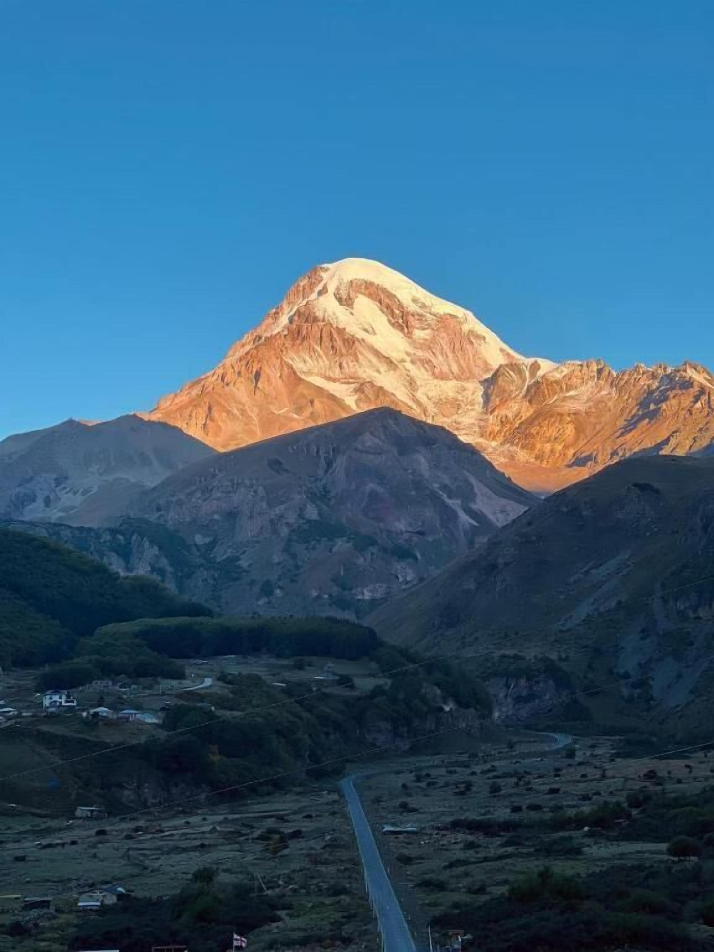 A mountain with a clear sky.