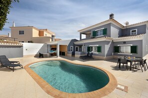 A residential property with a swimming pool, outdoor seating, and a patio area. - Villa "Delphin" with Private Pool, Terraces, and Wi-Fi (Lagos)