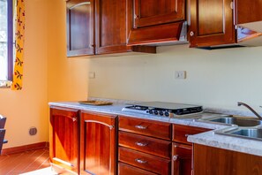 Fridge, stovetop, coffee/tea maker, cookware/dishes/utensils