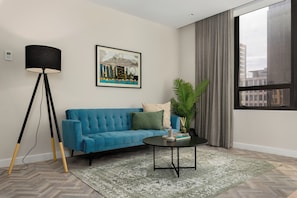 Design Apartment | Living area | 40-inch flat-screen TV with cable channels, Netflix, streaming services