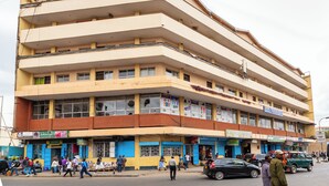 A multi-story building with commercial spaces on the ground floor. - Mang Hotel (Nairobi)