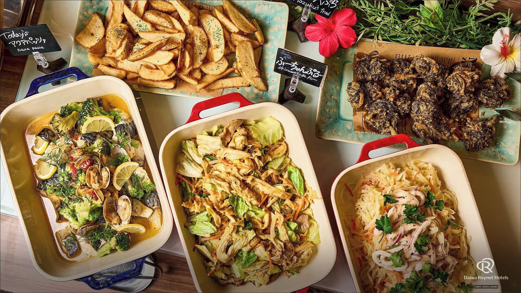 A variety of dishes including fish, potatoes, and salads, displayed in ceramic dishes on a table.