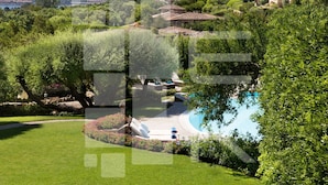 A poolside area with a clear view of the surrounding landscape, including a mountain in the distance. - Villa in Porto Rotondo with 7 bedrooms sleeps 14 (Porto Rotondo)