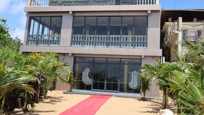 A building with a sign reading "SunSea Beach Resort".