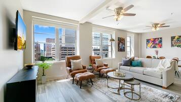 Signature Condo, 4 Bedrooms | Living room | 65-inch Smart TV with digital channels, foosball