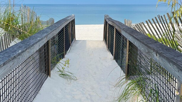 A pathway leading to a beach with a wooden fence on either side. - 5BR, Beach View, Elevator, Comm Pool, North Cape (Cape San Blas)