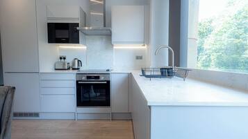 Junior Studio | Private kitchen | Full-size fridge, microwave, oven, stovetop