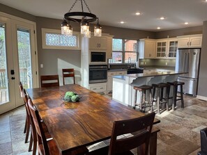 Enjoy cooking in this well-equipped kitchen with a central island and bar stools.