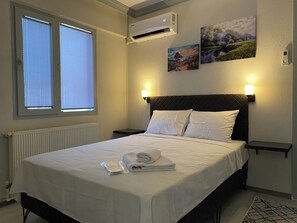 Chambre Confort avec lits jumeaux, 2 chambres, vue ville | Draps en coton égyptien, literie de qualité supérieure