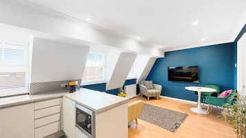 Family Apartment | Living area | 32-inch Smart TV with digital channels, Netflix, streaming services
