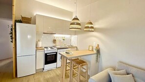 Coffee/tea maker, toaster, highchair, cookware/dishes/utensils