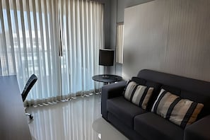 Apartment | Living area | 42-inch flat-screen TV with digital channels