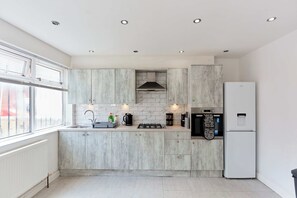 Fridge, oven, electric kettle, cookware/dishes/utensils