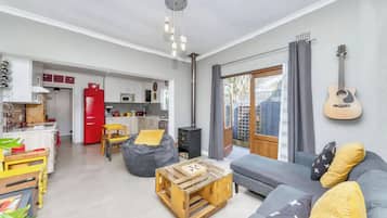 Basic House, Multiple Beds | Living area | TV