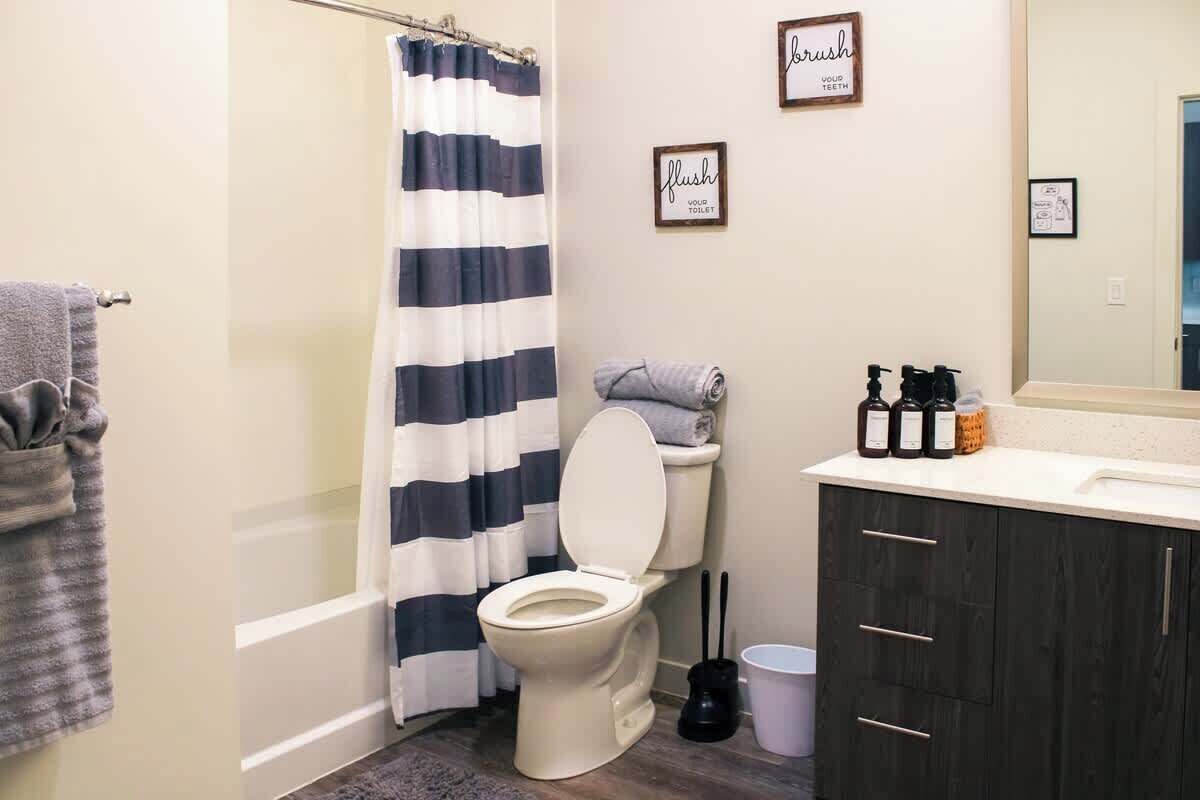 Shower, hair dryer, towels, shampoo
