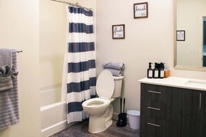 Shower, hair dryer, towels, shampoo