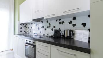 Apartment, 1 Bedroom | Private kitchen | Fridge, stovetop, cookware/dishes/utensils, dining tables
