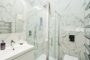 Shower, hair dryer, towels, soap