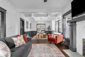 Smart TV, fireplace, books, offices