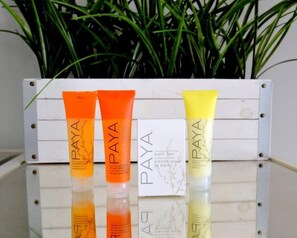 Three tubes of PAYA bath bar shampoo on a reflective surface with a white background and green plants. - 677 Beach Break ·Beautiful 3/3 Home w/ Heated Pool (Naples)