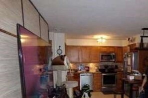 Kitchen area with microwave, sink, and stove.