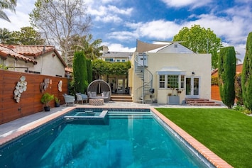 Welcome to The Diplomat's House! The entire downstairs floor of the house is all yours. Please keep in mind this is a shared property and there are guests above this unit. Salt water pool, spa, fire pit, and backyard with artwork and beautiful cust