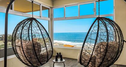 Tropical retreat with ocean views - steps from the sand with alfresco dining