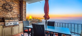 Waterfront condo with heated pool, hot tub, balcony, fireplace, & central AC