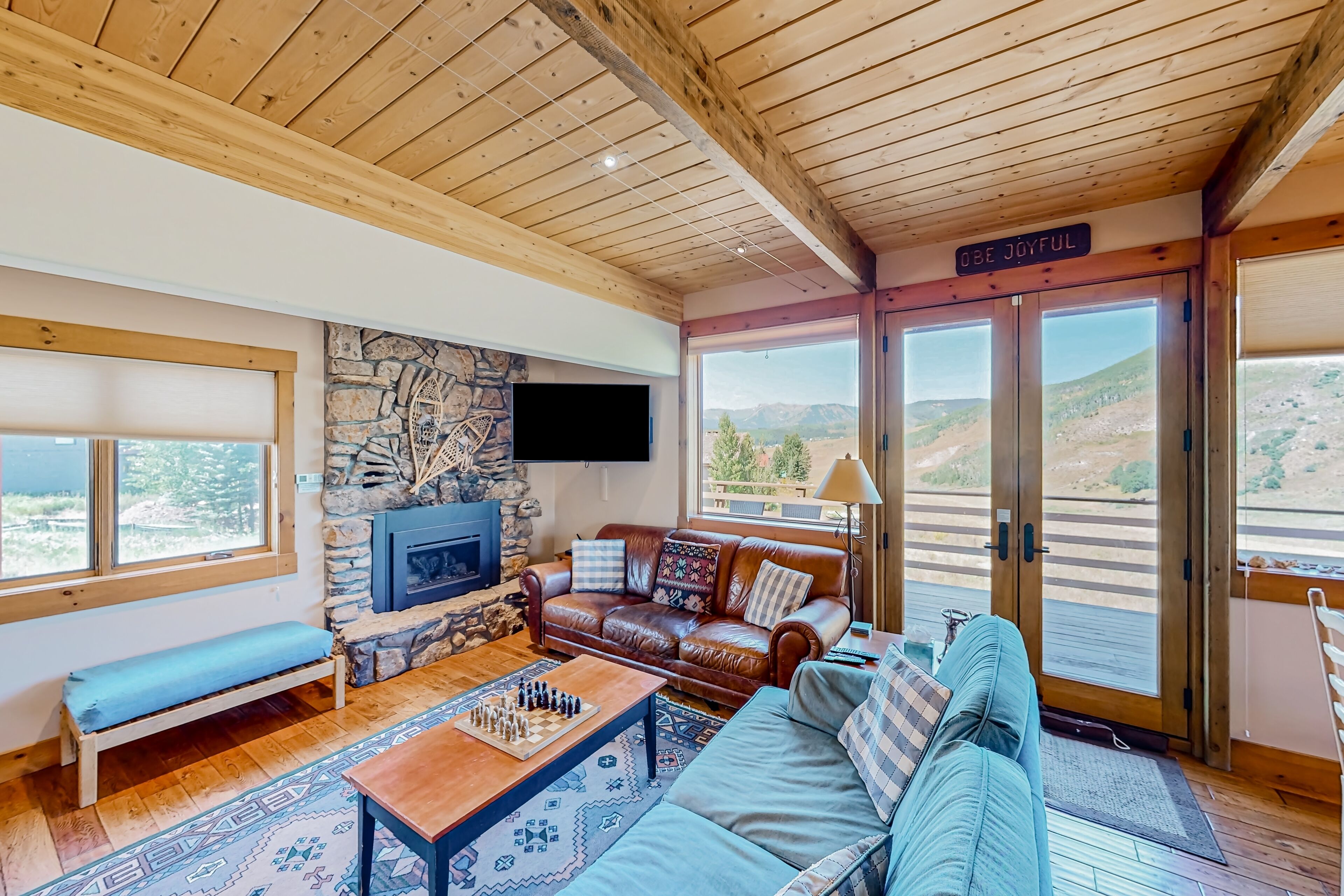 Mountain-view home with private hot tub, fireplace, deck, grill, & W/D