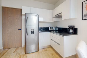 Fridge, microwave, stovetop, coffee/tea maker