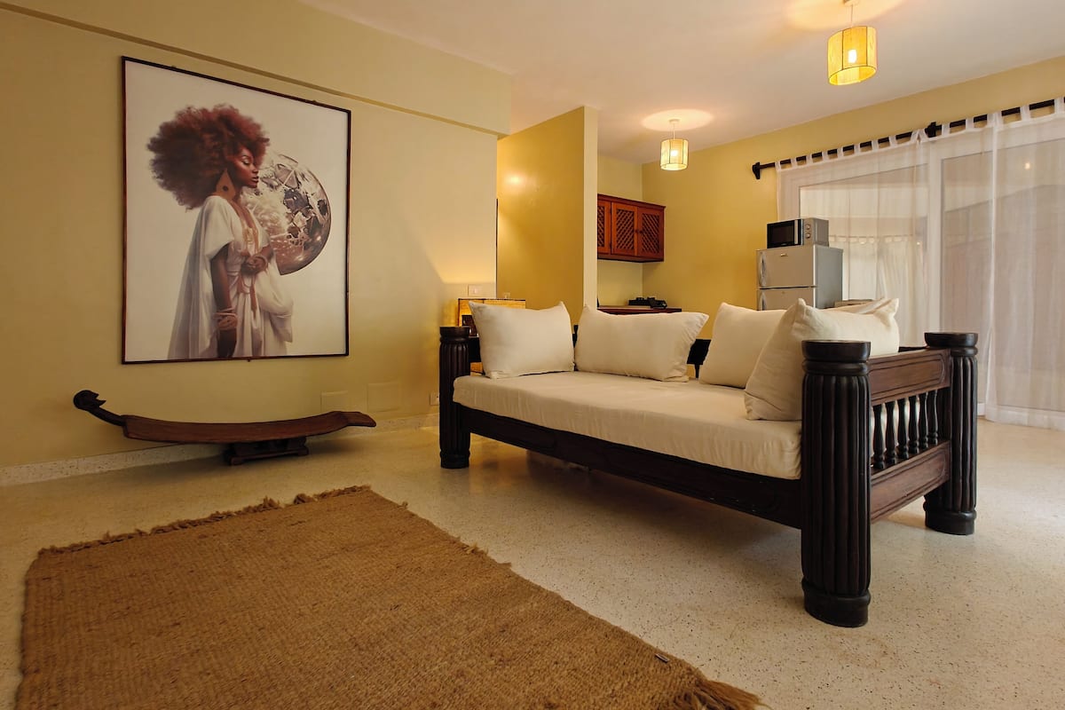 Deluxe Condo, 1 Bedroom, Garden View, Ground Floor | Living area | 42-inch Smart TV with digital channels, Netflix, streaming services