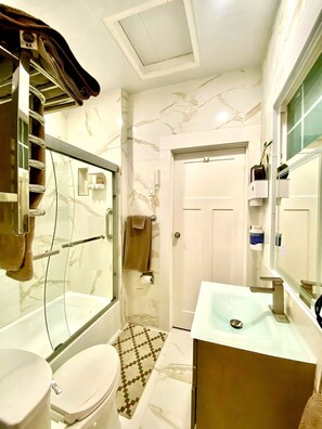 Shower, hair dryer, towels, soap